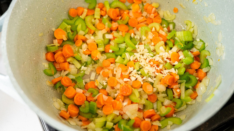 chopped vegetables in white pot