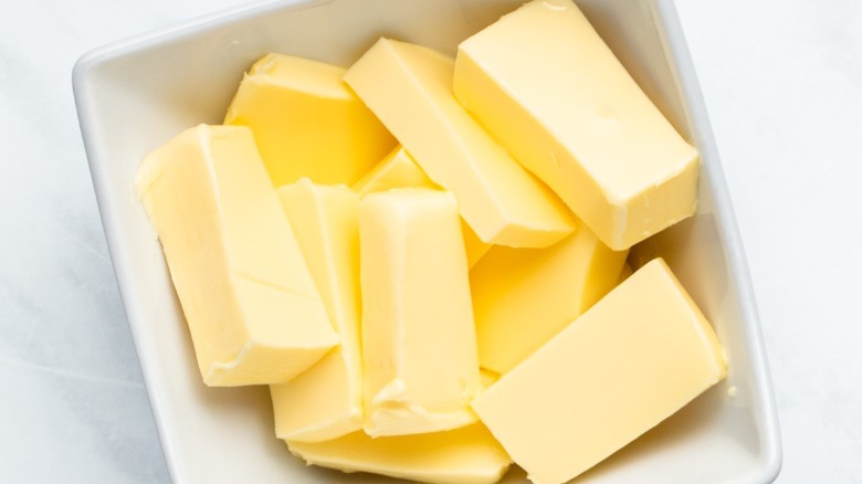 butter chunks in white bowl