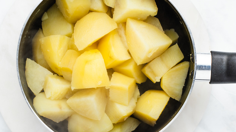 saucepan with drained potatoes