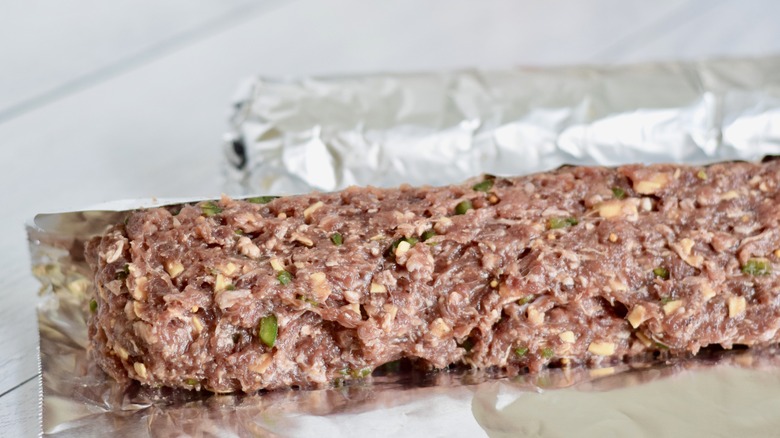 raw summer sausage in foil