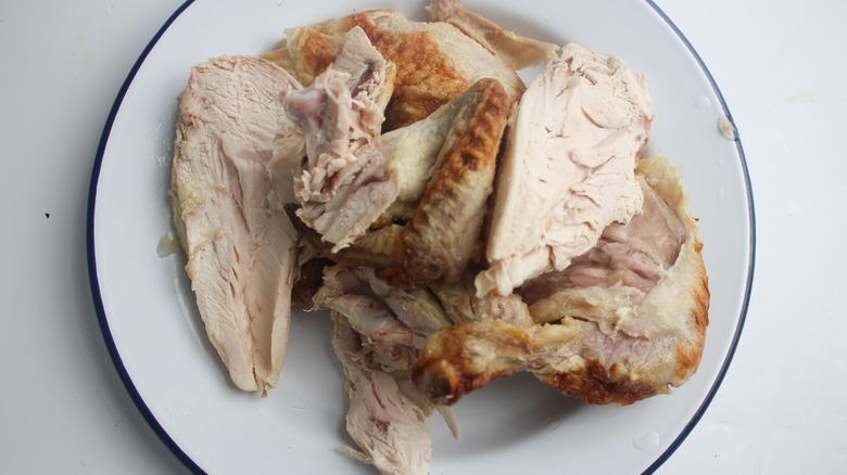 sliced rotisserie chicken on plate