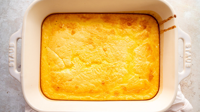 golden brown spoonbread in dish