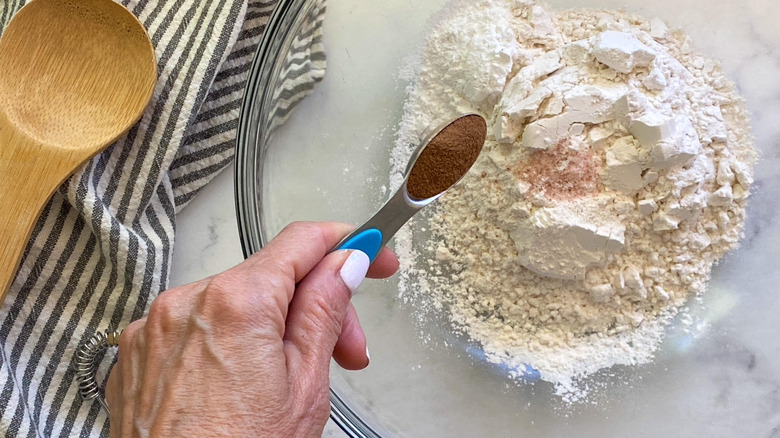 adding dry ingredients to bowl 