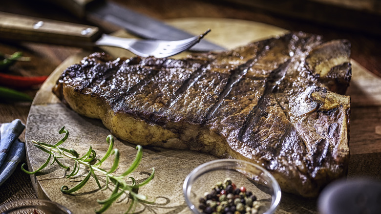 Grilled steak on wooden board