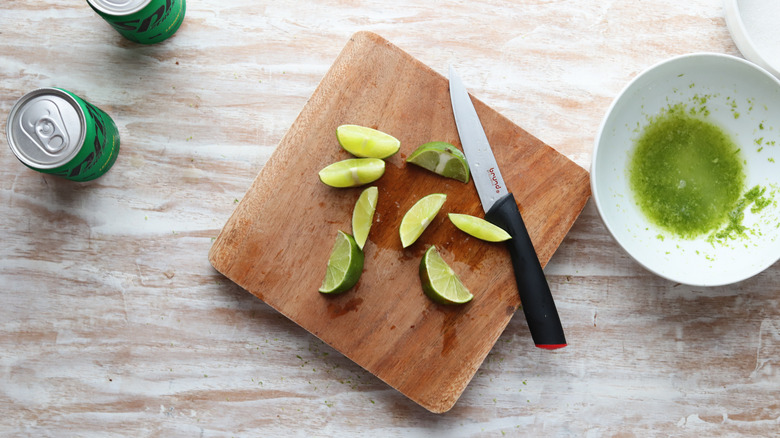 sliced limes on cutting board