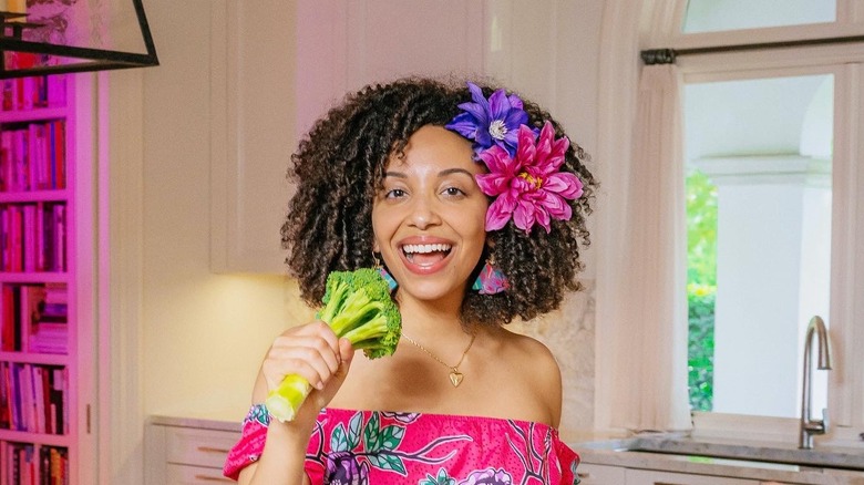 Gabrielle Reyes holding broccoli