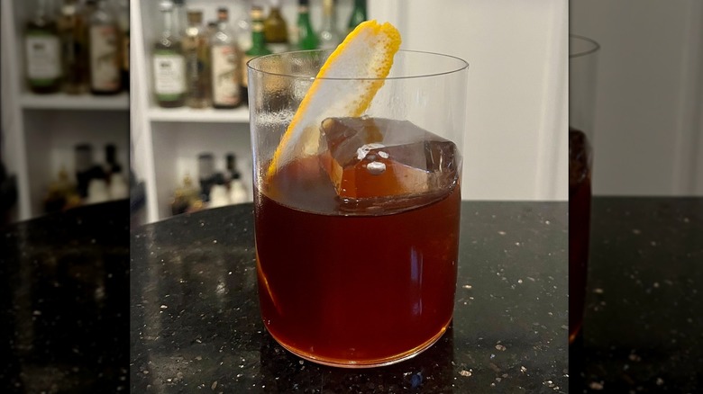 coffee negroni with lemon slice in glass cup