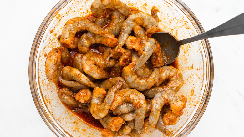 Shrimp marinating in bowl