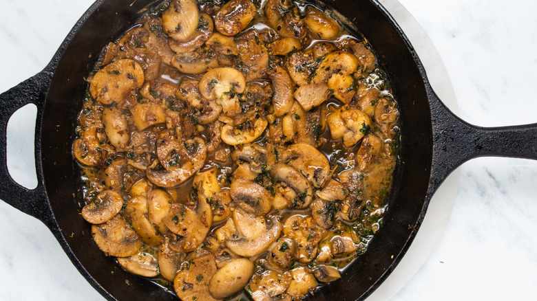 mushrooms and sauce in pan