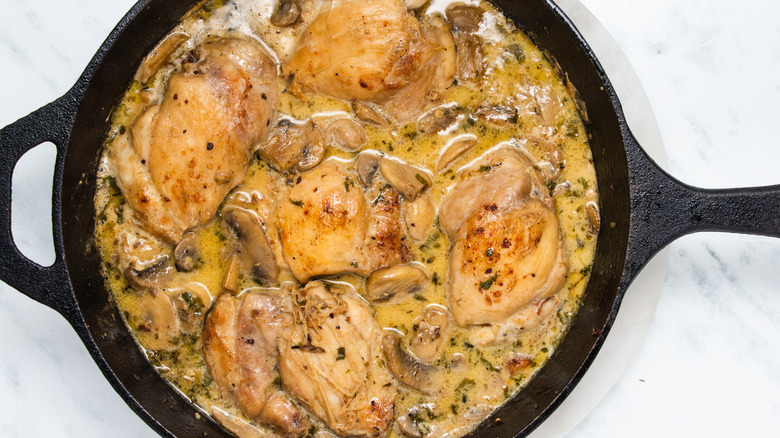 chicken and mushrooms in pan