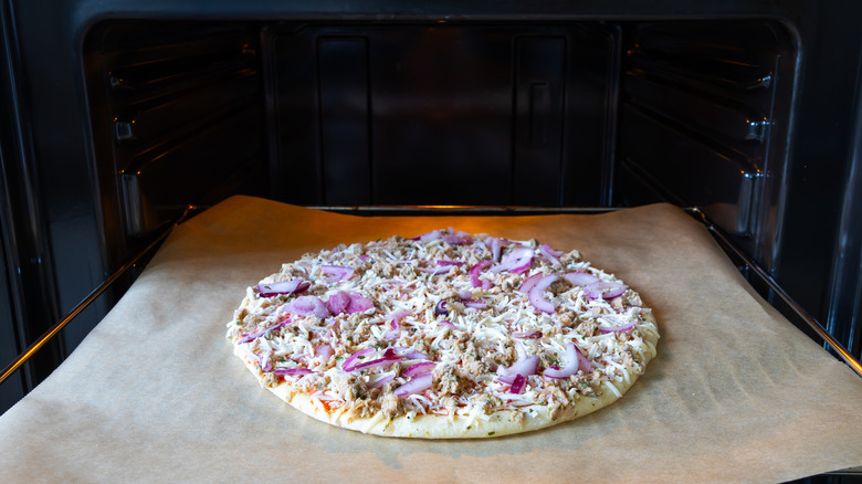 frozen pizza on baking sheet