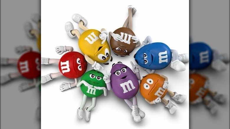 The M&M's spokescandies lying in a circle