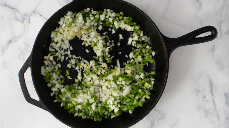 diced veggies in skillet pan