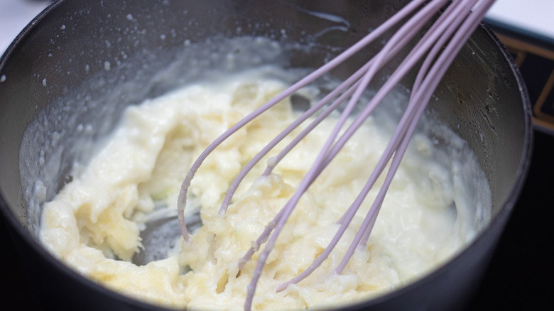 Slow Cooker Au Gratin Potatoes - whisking in the flour