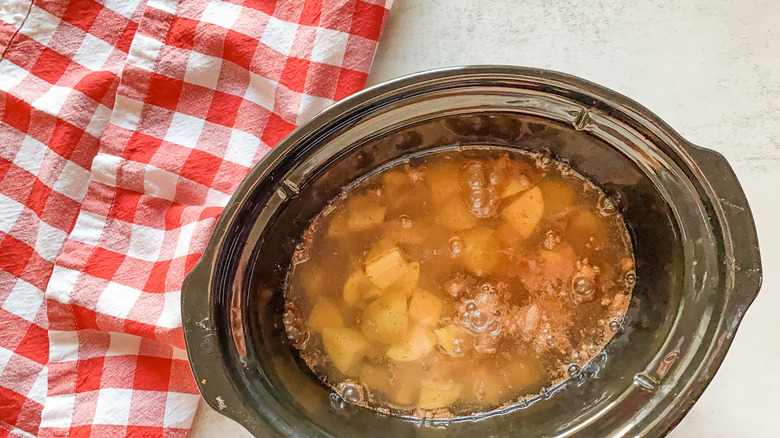 potatoes, soup mix, and water in slow cooker