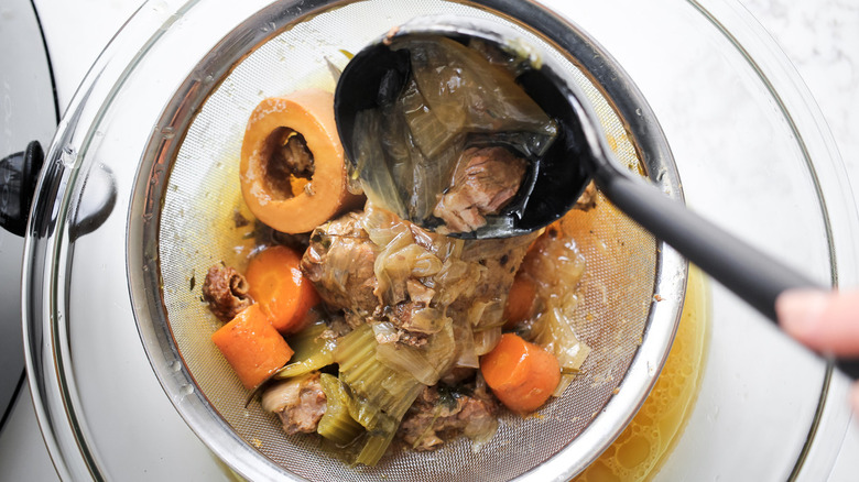 meat and vegetables in strainer