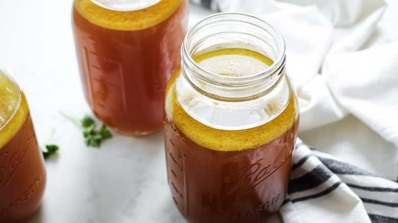 beef stock in large jars