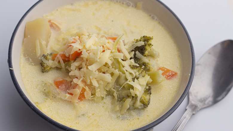 bowl of slow cooker homemade broccoli potato cheese soup