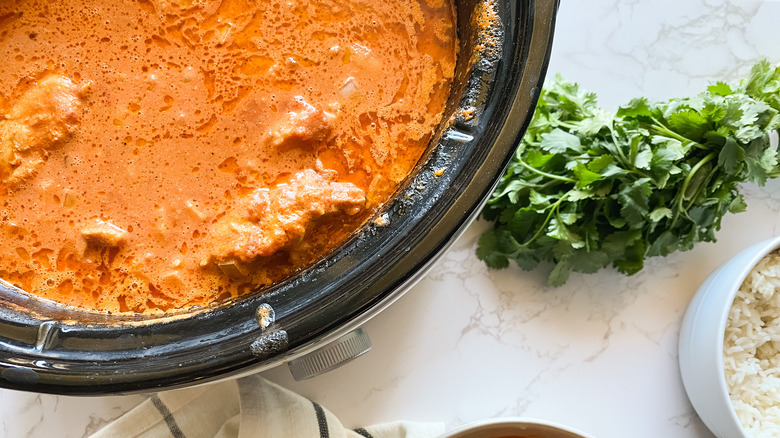 Butter Chicken simmering in a slow cooker