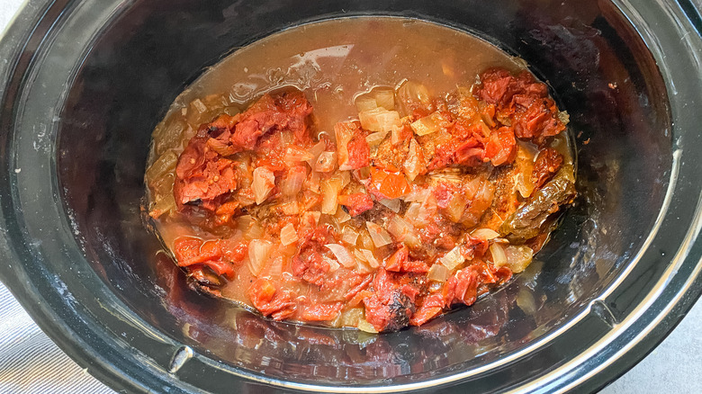 chicken and spices in slow cooker 