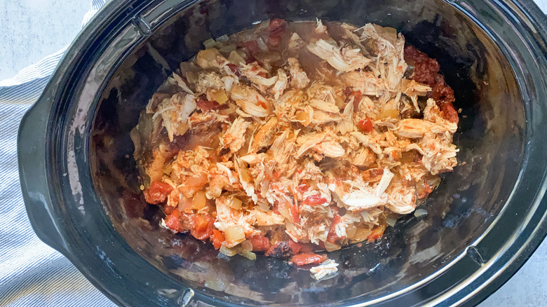 chicken and spices in slow cooker 