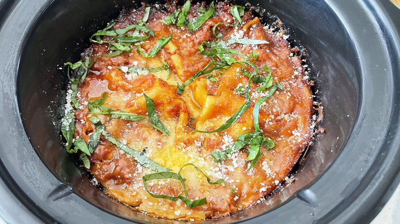 lasagna in slow cooker with fresh basil