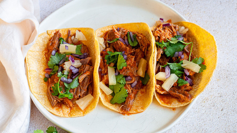 Tacos al pastor on plate