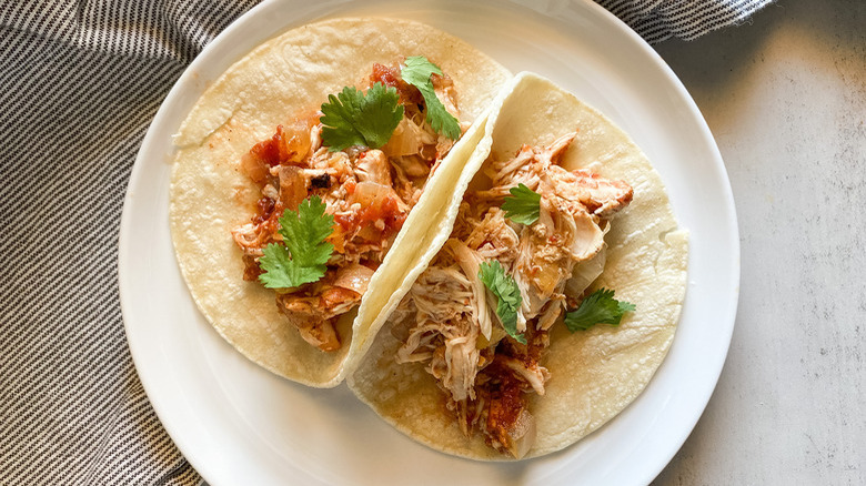 Shredded chicken on tortillas