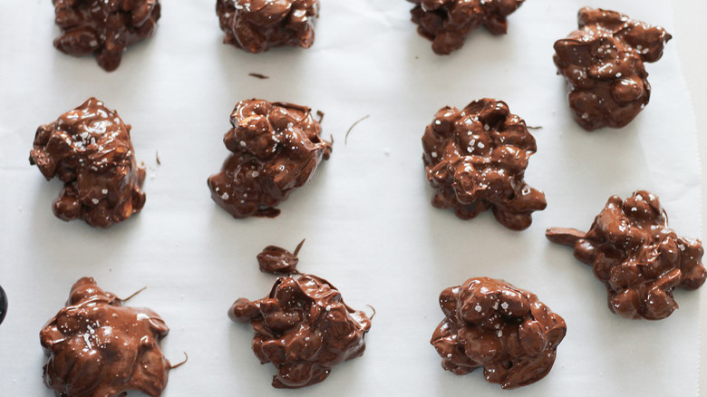 Chocolate nut clusters on paper