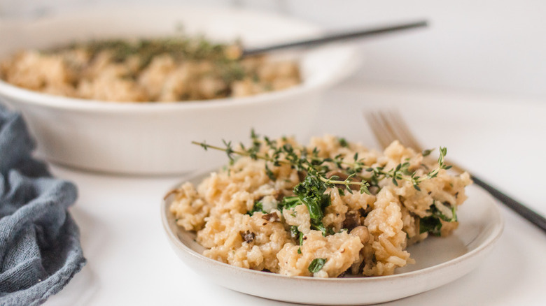 Risotto on white plate with thyme