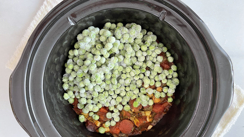 Slow Cooker Seafood Paella in slow cooker with peas 