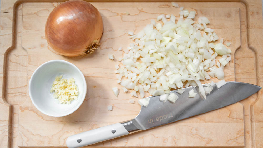 dicing an onion for slow cooker white chicken chili