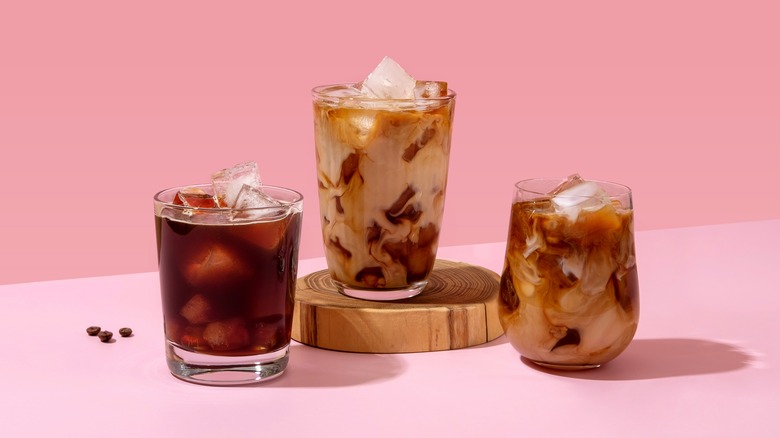 Iced coffees on pink background