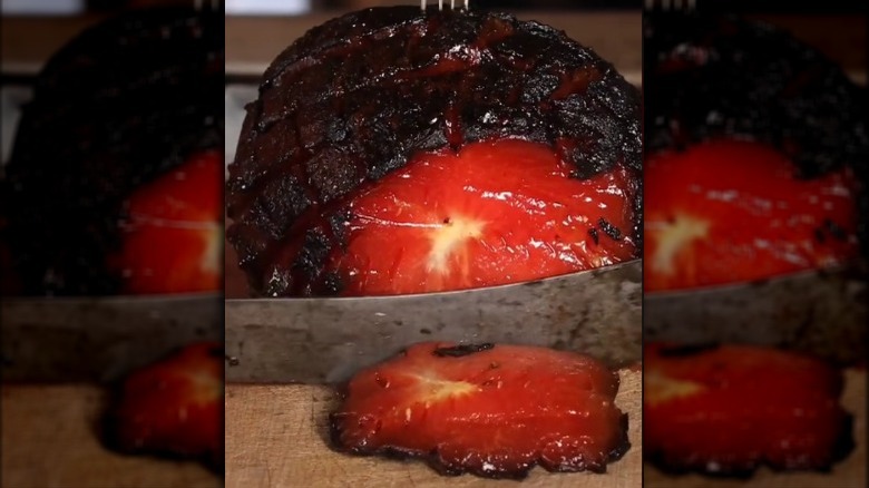 slicing smoked watermelon ham 