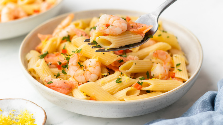 Smoked salmon and shrimp pasta in a bowl