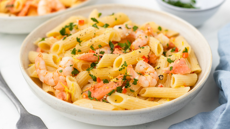 Smoked salmon and shrimp pasta in a bowl