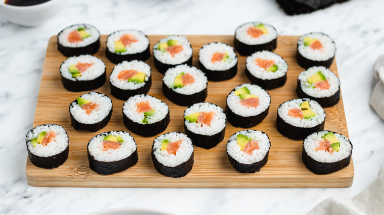 smoked salmon sushi on board 