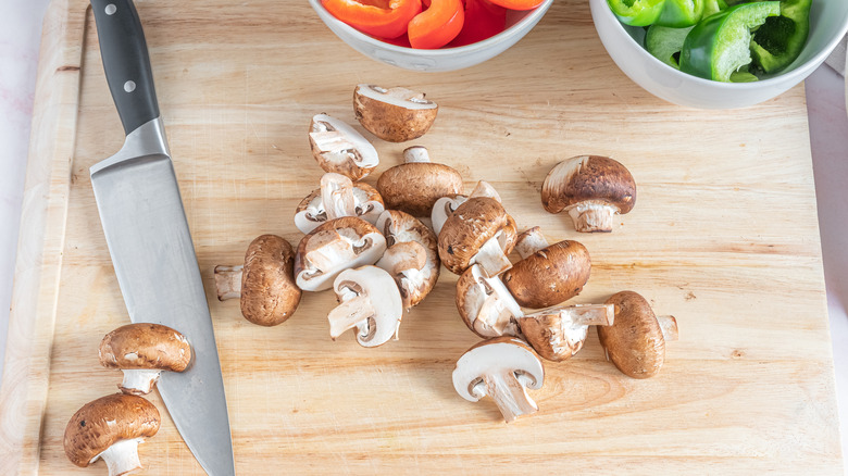 cutting mushrooms and peppers