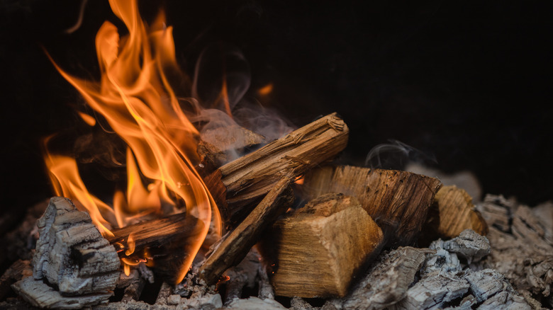 Wood burning in a smoker