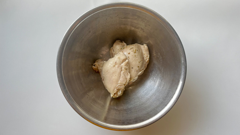 cooked chicken in metal bowl