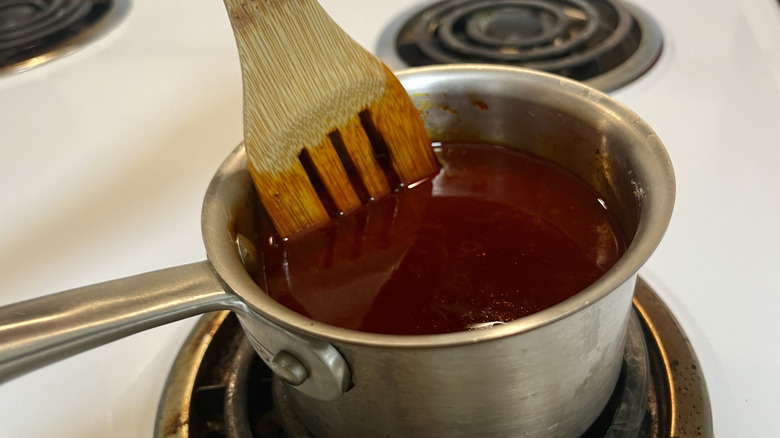 brown liquid in metal pot