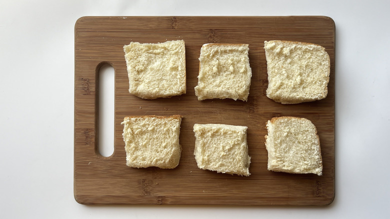 bread rolls on wooden board