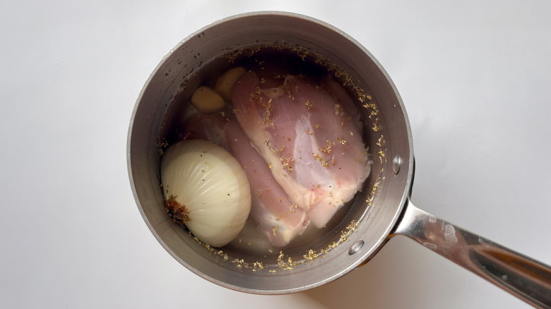 chicken and water in pot