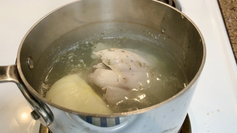 chicken and water in pot