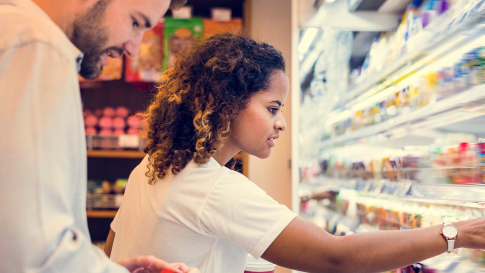 couple shopping at grocery store