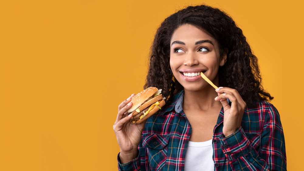 woman eating a French fry