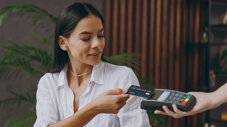 woman paying with card