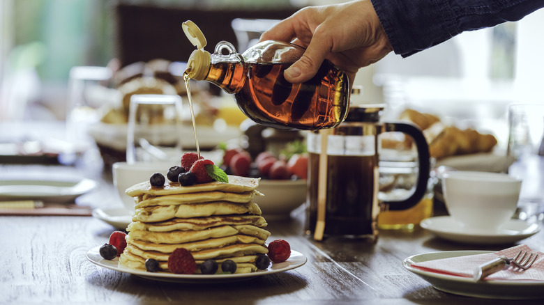 syrup pouring on pancakes