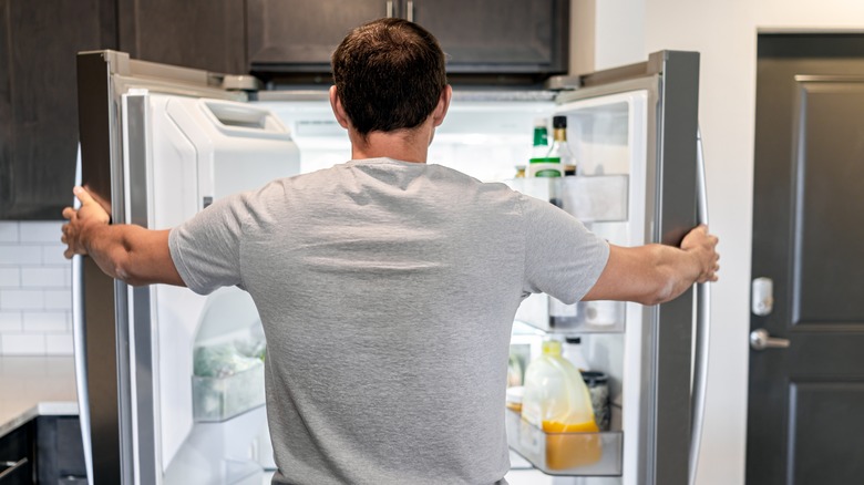 Person opens a fridge