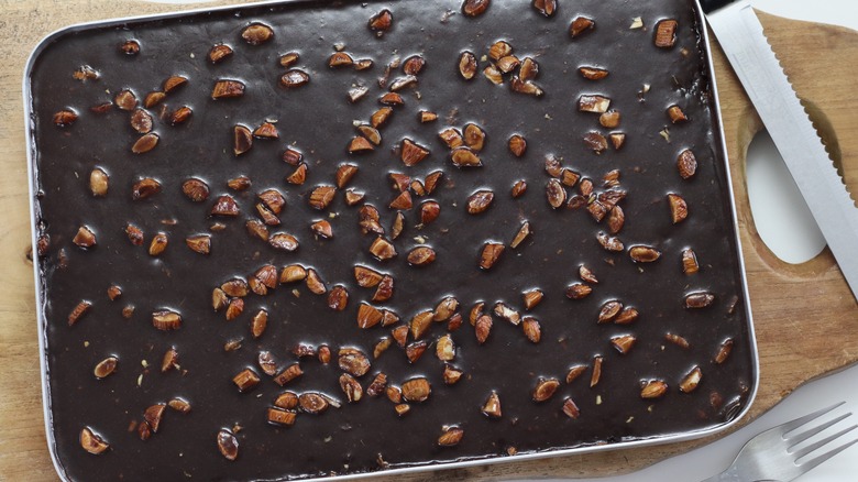 Texas sheet cake with chocolate and pecan top layer.